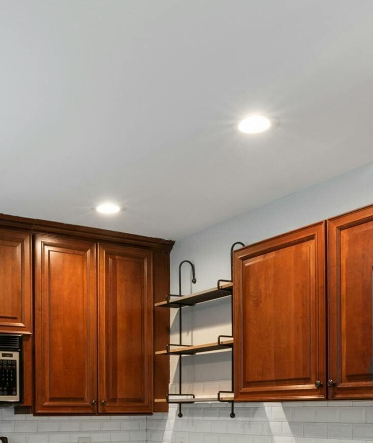 Elegant kitchen interior featuring wooden cabinetry and stainless steel appliances.