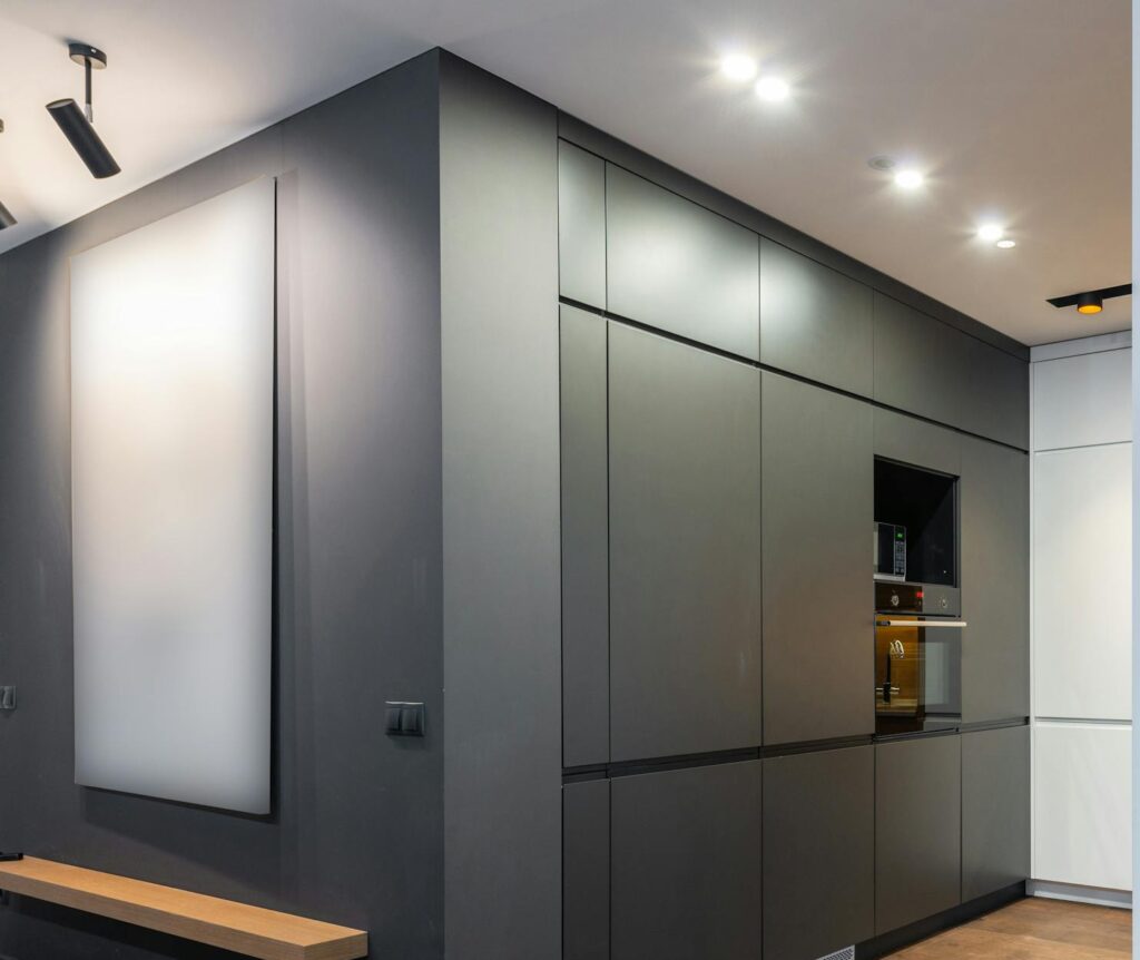 Sleek modern kitchen interior with minimalist design and studio lighting, showcasing contemporary style.
